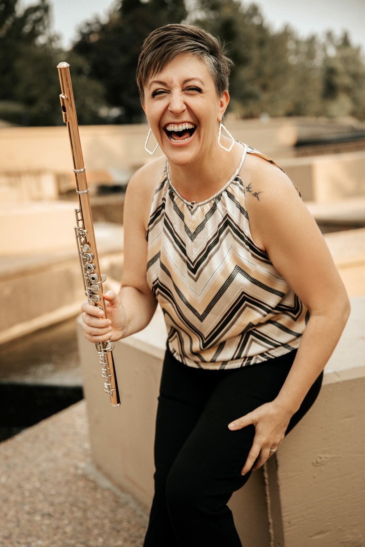 Megan Lanz laughs and holds her instrument