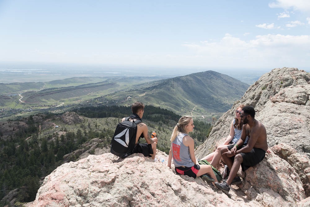 Students hike Horsetooth with Fort Collins in the backdrop.